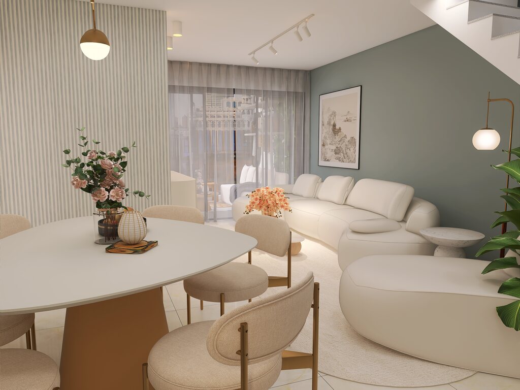 Sofá grande em uma sala com plantas e uma mesa